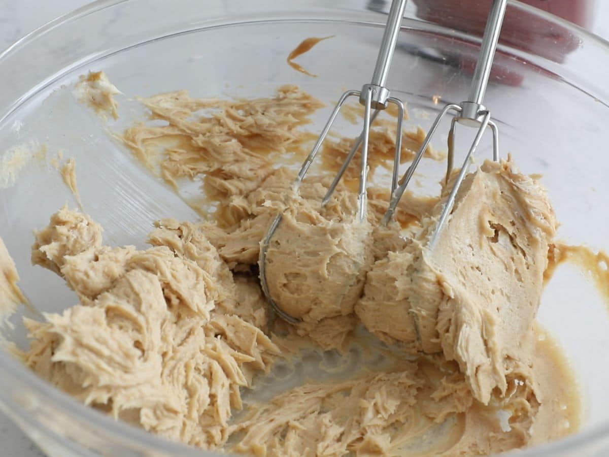 large bowl with peanut butter mixture and beaters.