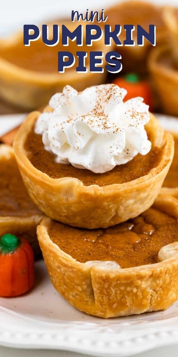 Close up photo of mini pumpkin pies stacked on top of eachother and the top one has whipped cream and recipe title on top of photo