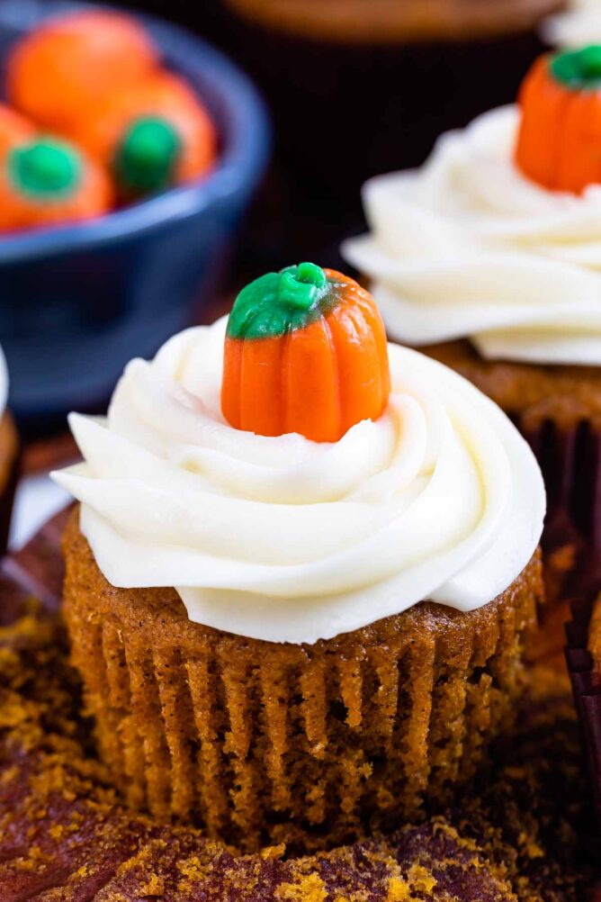Close up of pumpkin cupcake with pumpkin candy on top