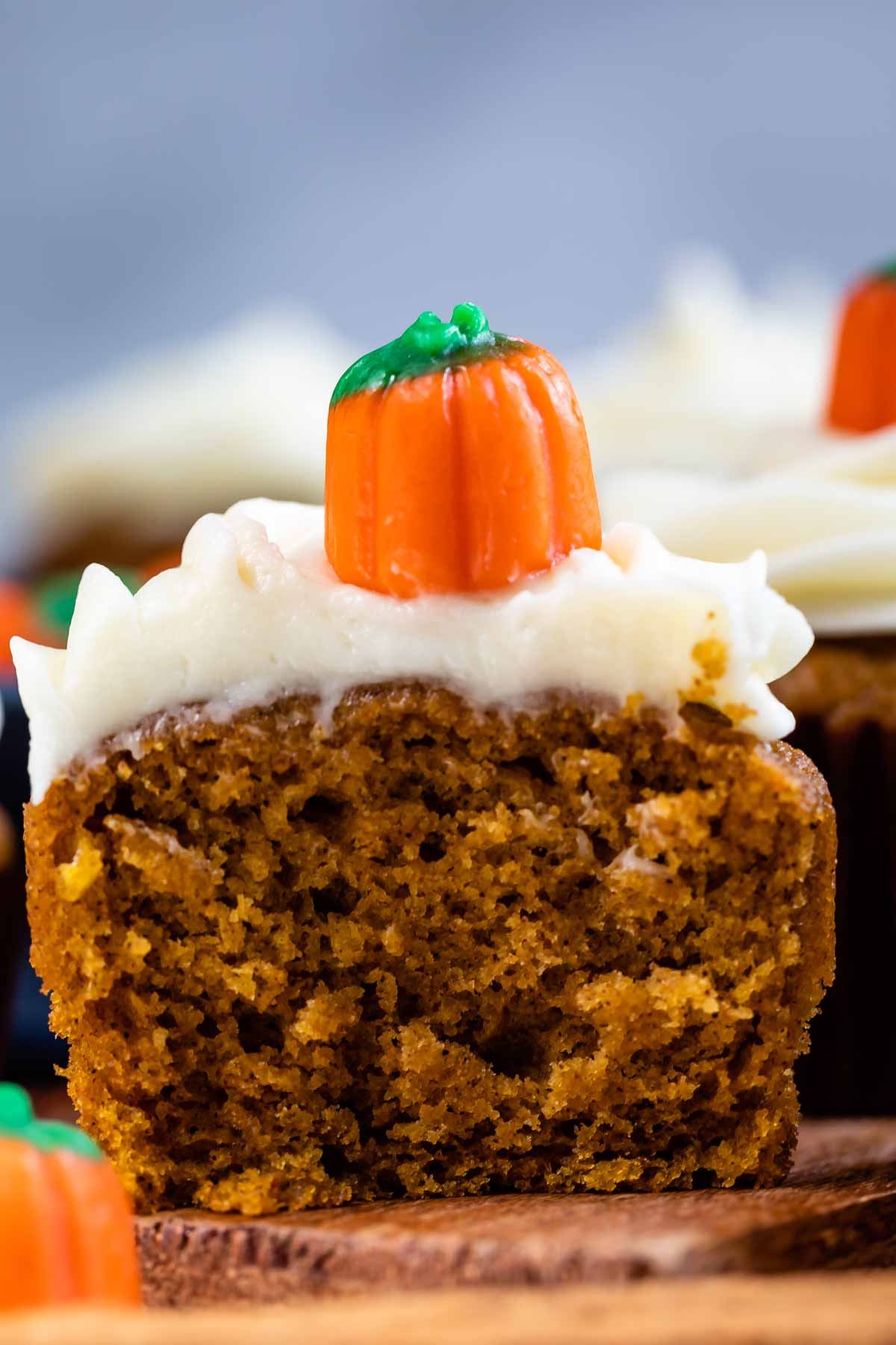 Close up of pumpkin cupcake cut in half to show middle