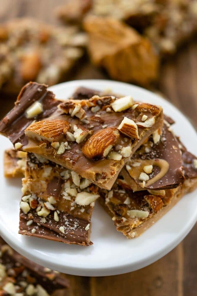 Toffee pieces stacked on a white serving plate