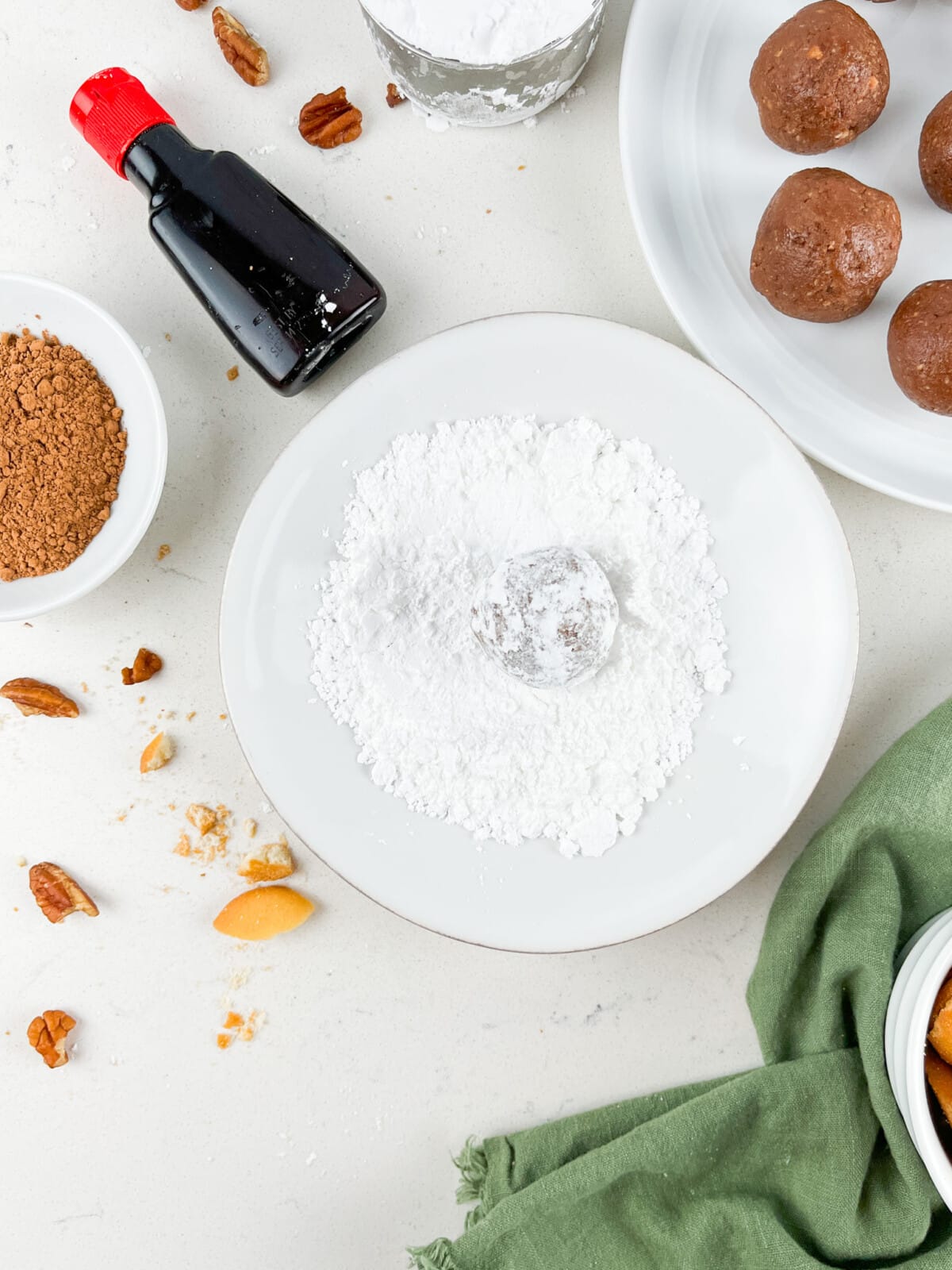 ball being rolled in powdered sugar.