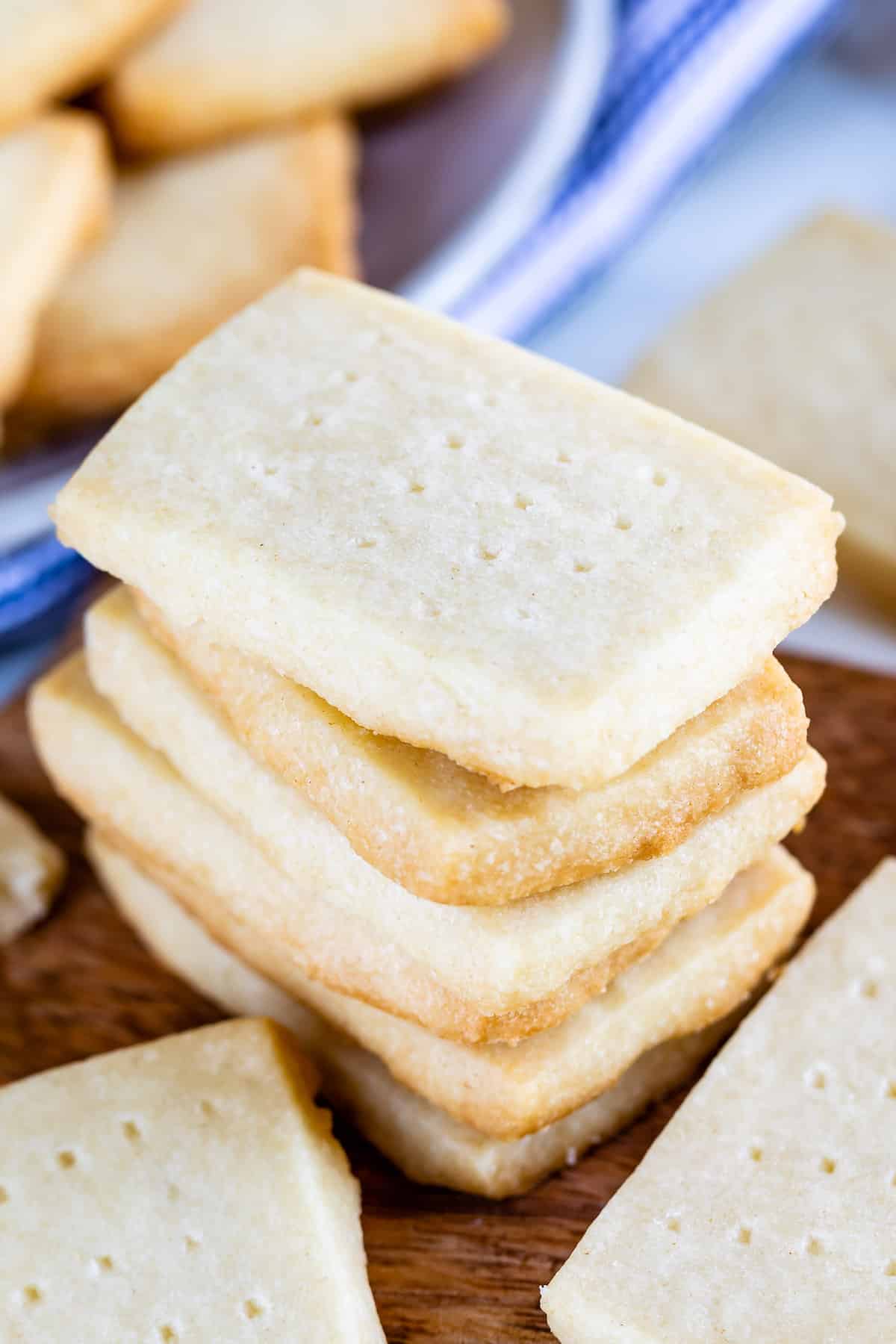 stack of shortbread cookies on wood cutting board