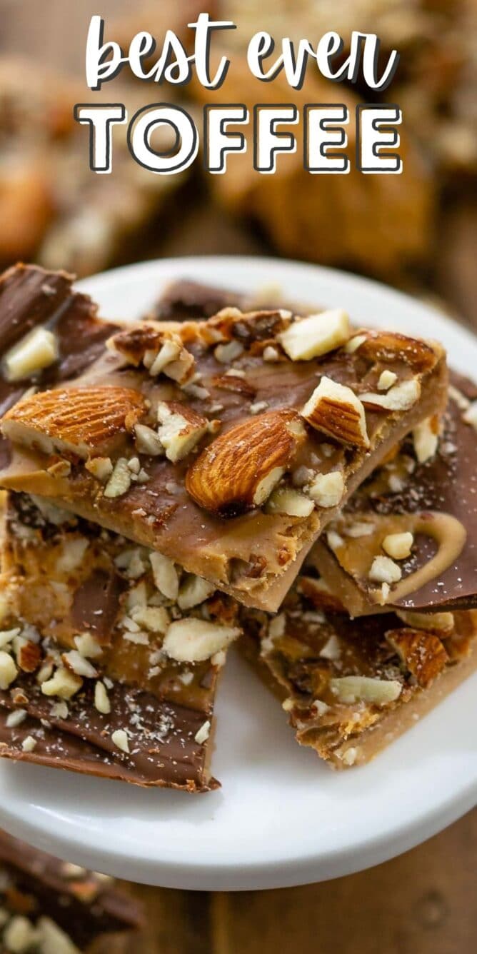 Toffee pieces stacked on a white serving plate with recipe title on top of image