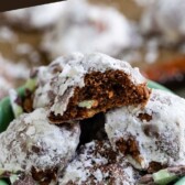 Mint colored bowl full of mint snowball cookies with ingredients around the bowl and one snowball cut in half to show filling and recipe title on top of image