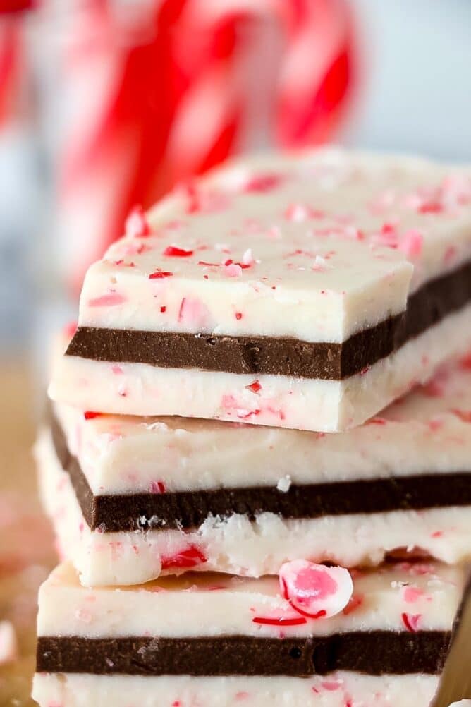 Close up photo of three peppermint bark pieces stacked on top of eachother