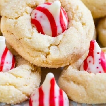 Peppermint blossom cookies with recipe title on bottom of photo in a red color block