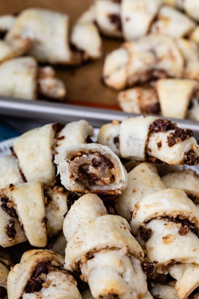 stack of rugelach on plate with one cut in half