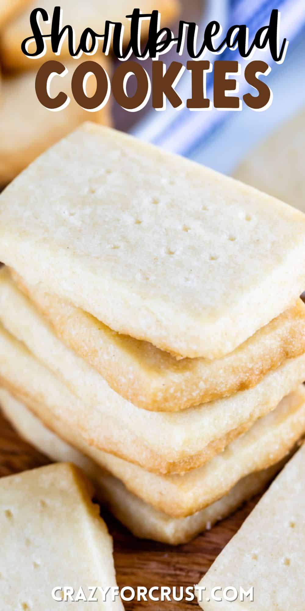 stack of shortbread cookies on wood cutting board with words on photo