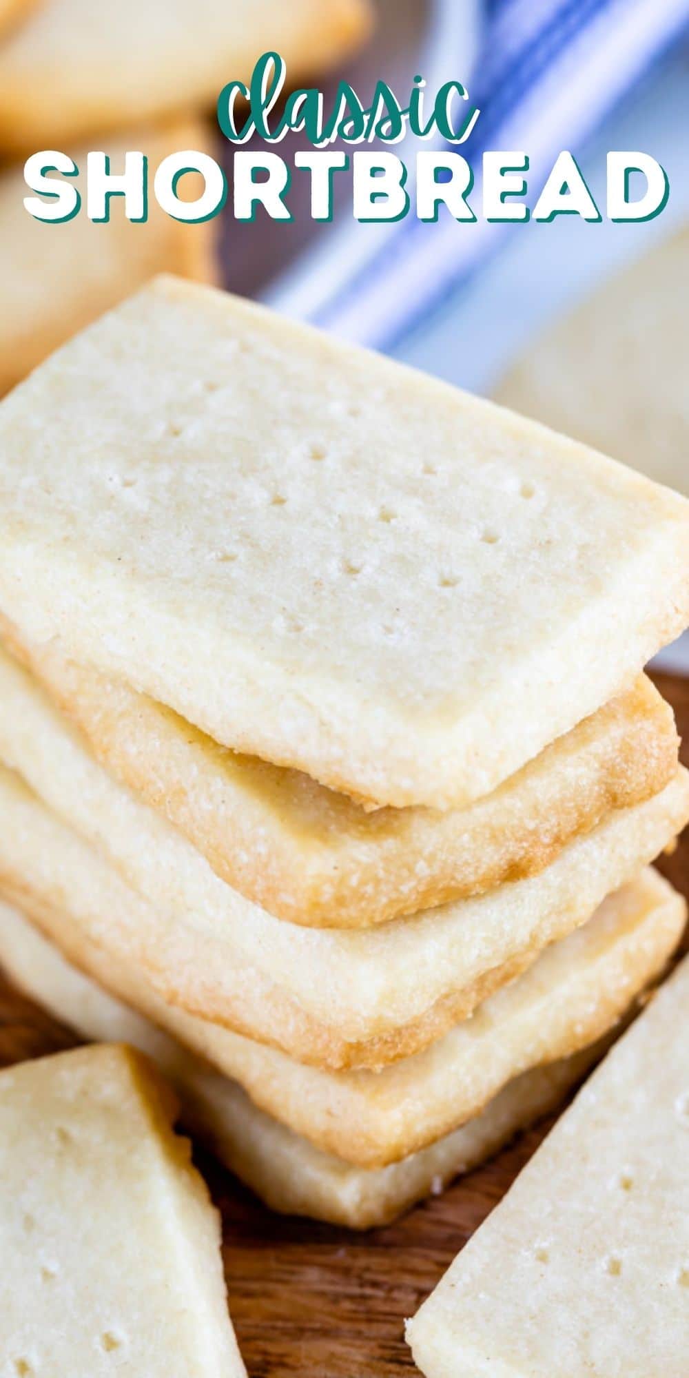 Stack of rectangular shortbread cookies on a wood cutting board with recipe title on top of image