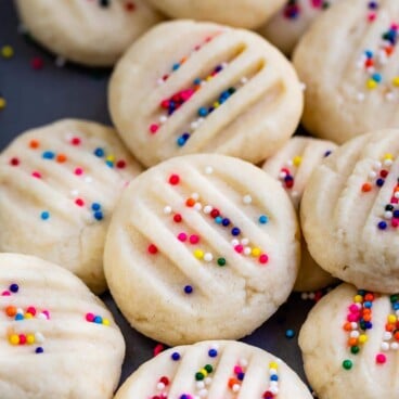 whipped shortbread in a pile with rainbow nonpareils