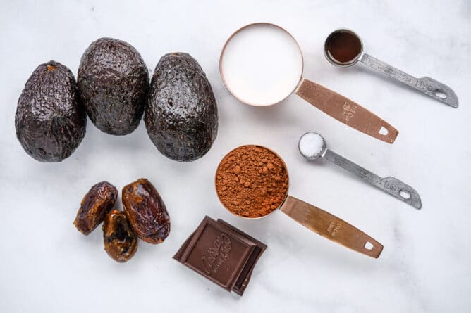 Overhead shot of all ingredients measured out for avocado chocolate mousse