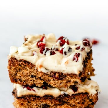 Two cranberry bliss bars stacked on eachother