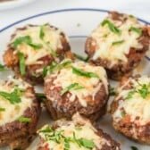 Six mini meatloaves on a plate with cheese on top and recipe title on top of image