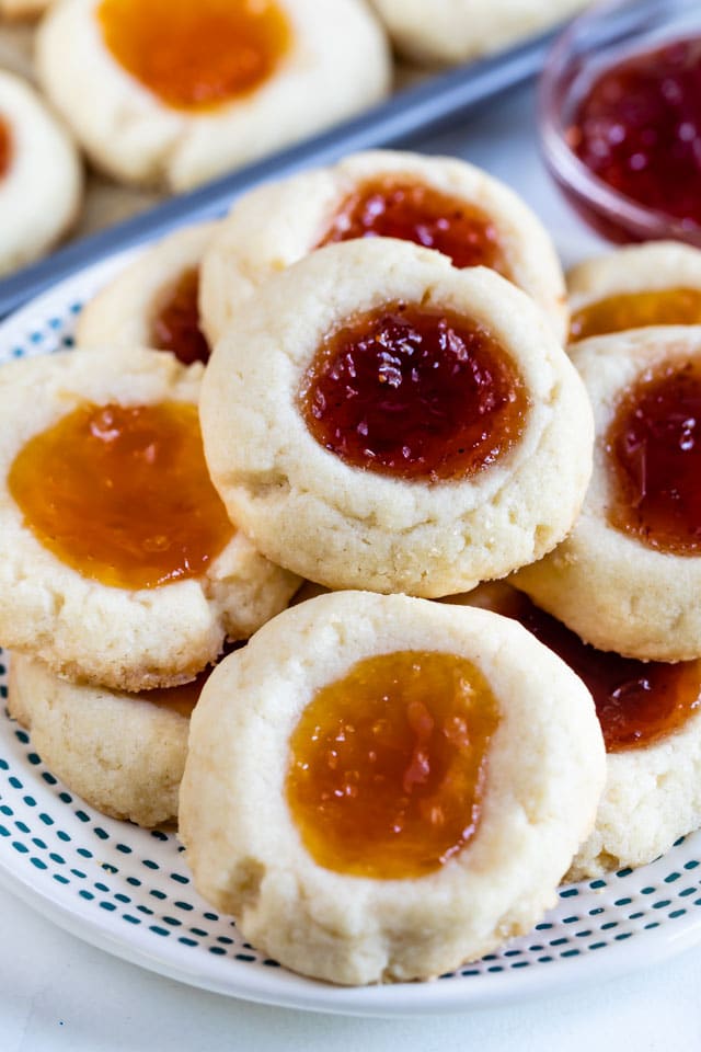 Overhead view of a plate full of jam thumbprint cookies