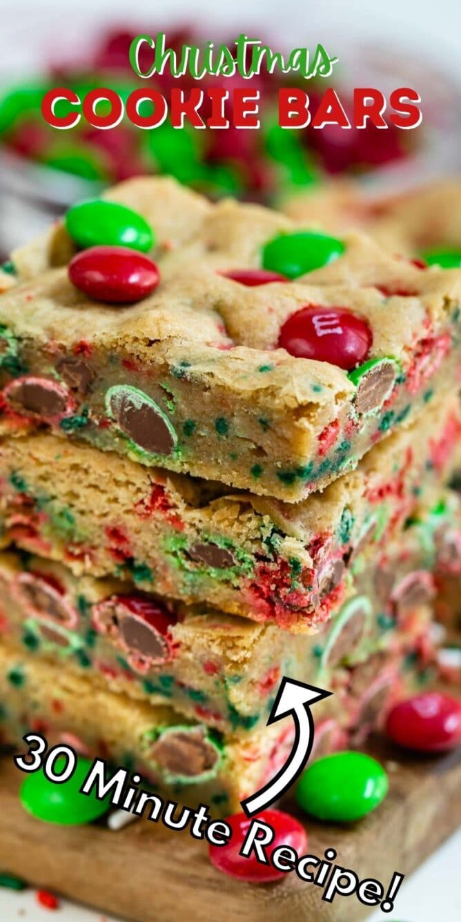 Stack of christmas cookie bars with m&ms around them and recipe title on top of image