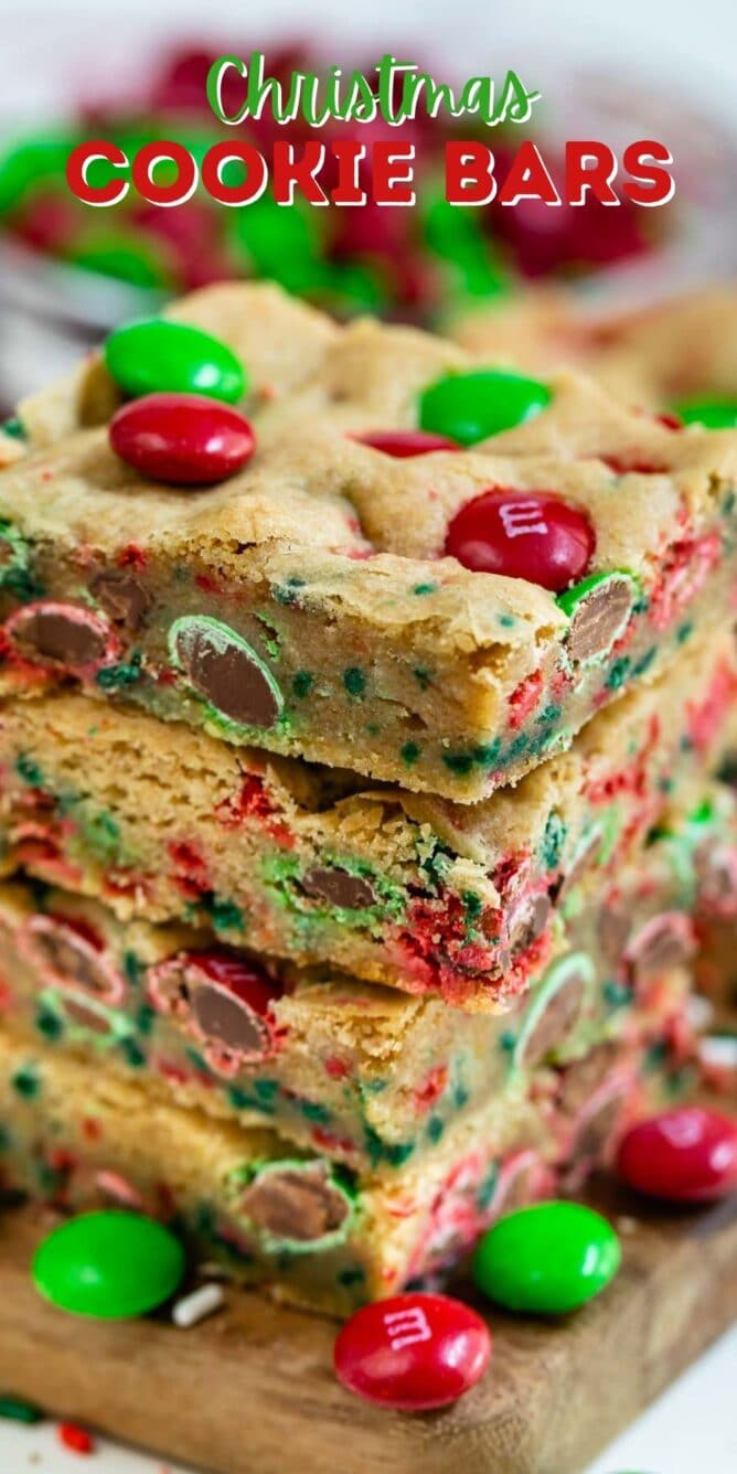 Stack of christmas cookie bars with m&ms around them and recipe title on top of image