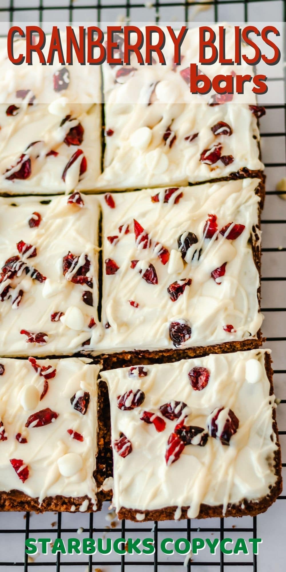 Overhead view of cranberry bliss bars on a metal cooling rack cut into squares with recipe title on top of photo