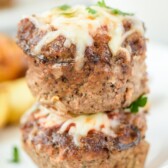 Close up shot of two mini meatloaves stacked on eachother