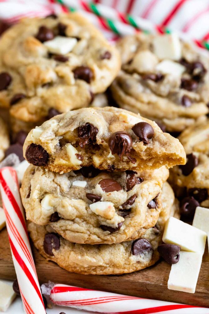 Lots of peppermint chocolate chip cookies with one split in half to show inside