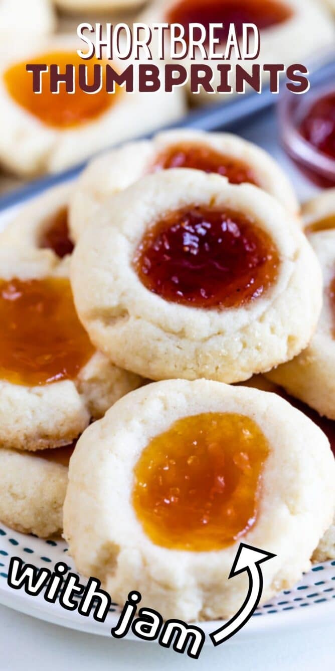 Overhead view of a plate full of jam thumbprint cookies with recipe title on top of image