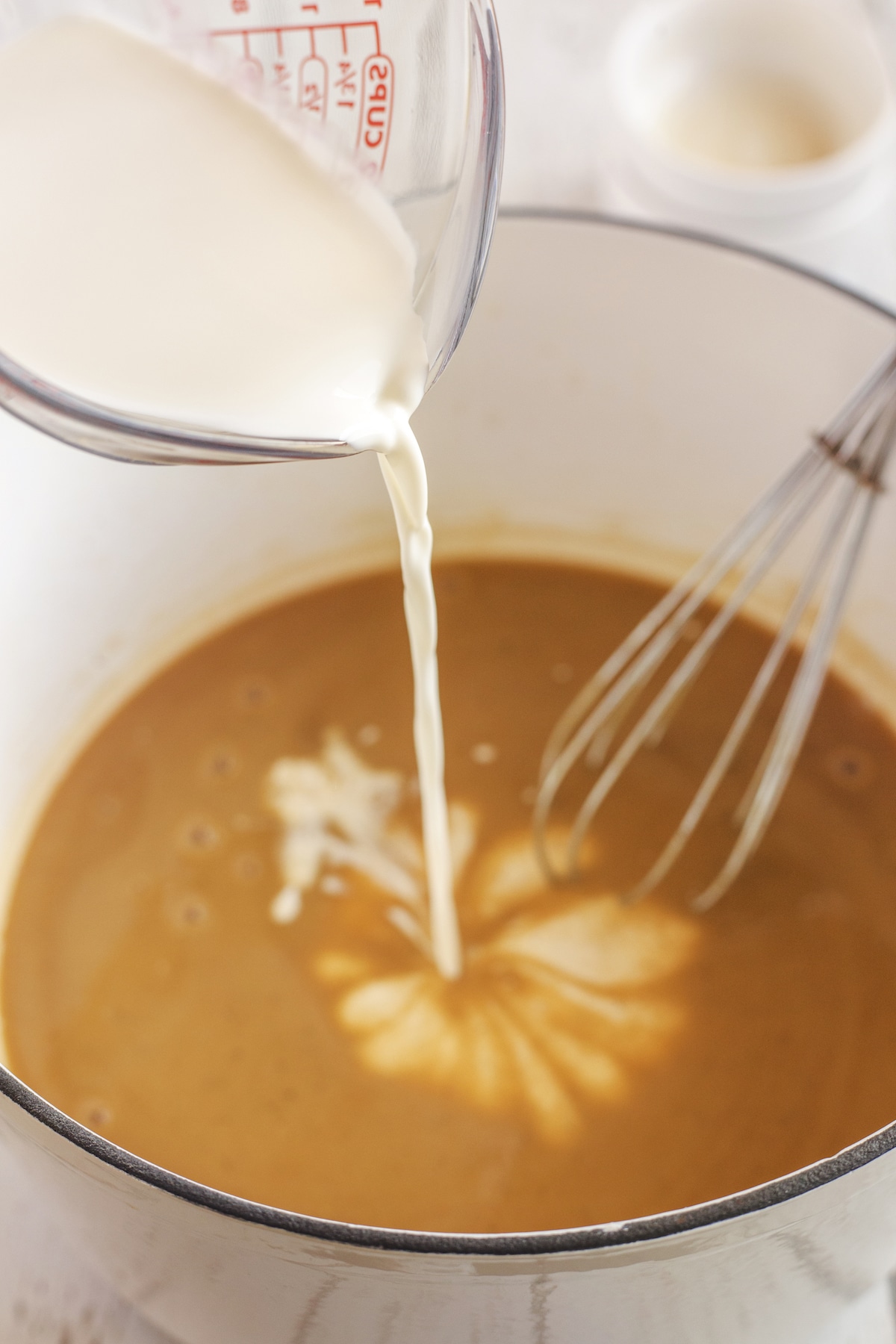 pouring milk into pot