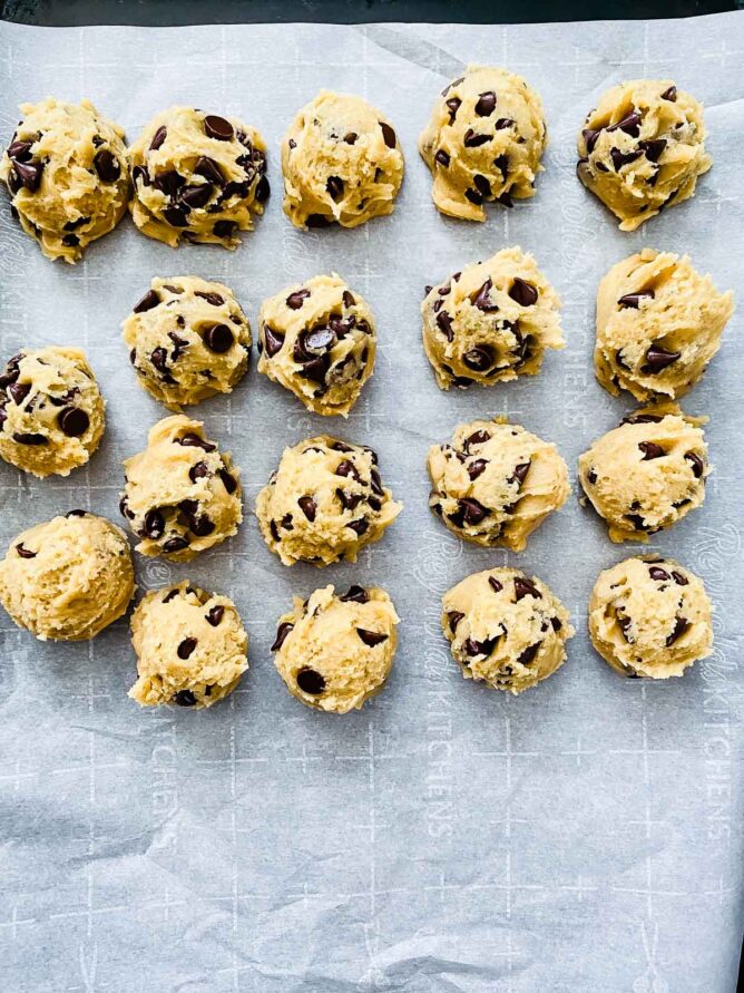 cookie dough balls on cookie sheet