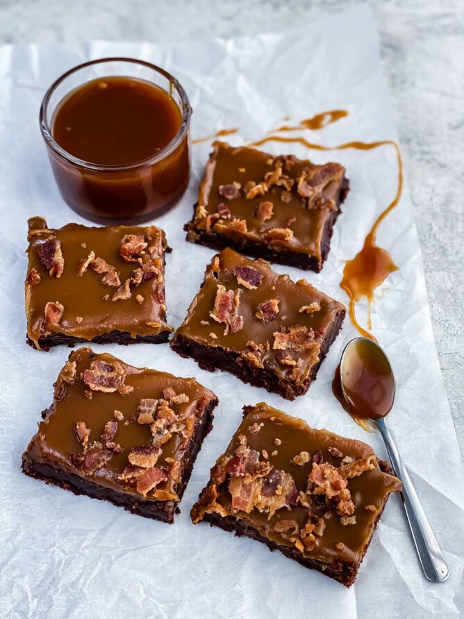 brownie with caramel and bacon on parchment paper