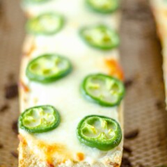 Close up shot of jalapeno cheese bread on sheet pan after baking