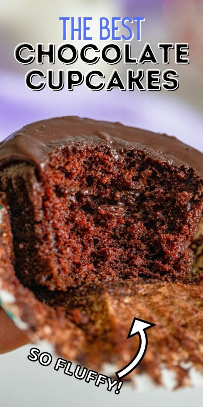 The best chocolate cupcake cut in half to show the fluffy inside with recipe title on top of image