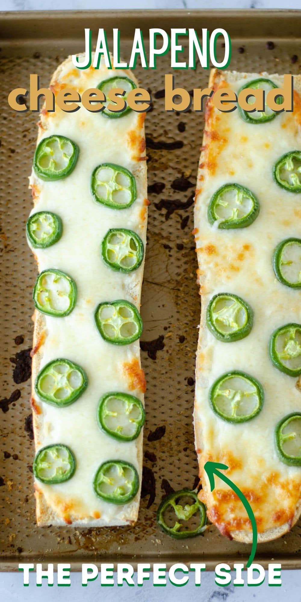 Overhead shot of two loaves of baked jalapeno cheese bread on a sheet pan with recipe title on top of image