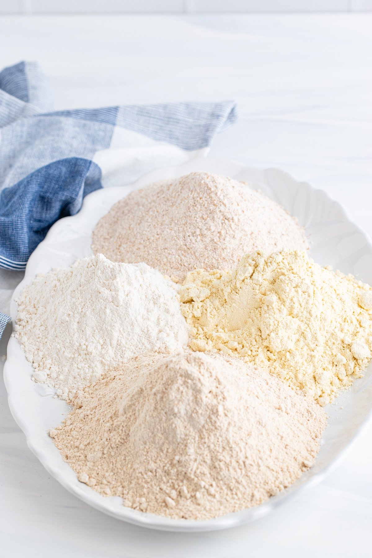 Four types of baking flours on a serving dish