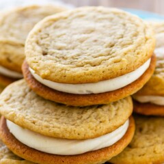 Stack of homemade golden oreos on a blue plate