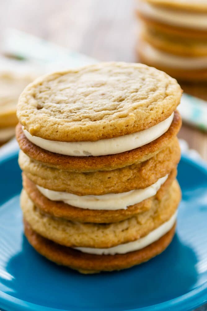 Three homemade golden oreos stacked on eachother on a blue plate