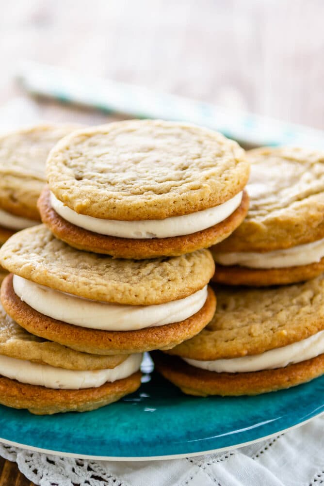 Stack of homemade golden oreos on a blue plate