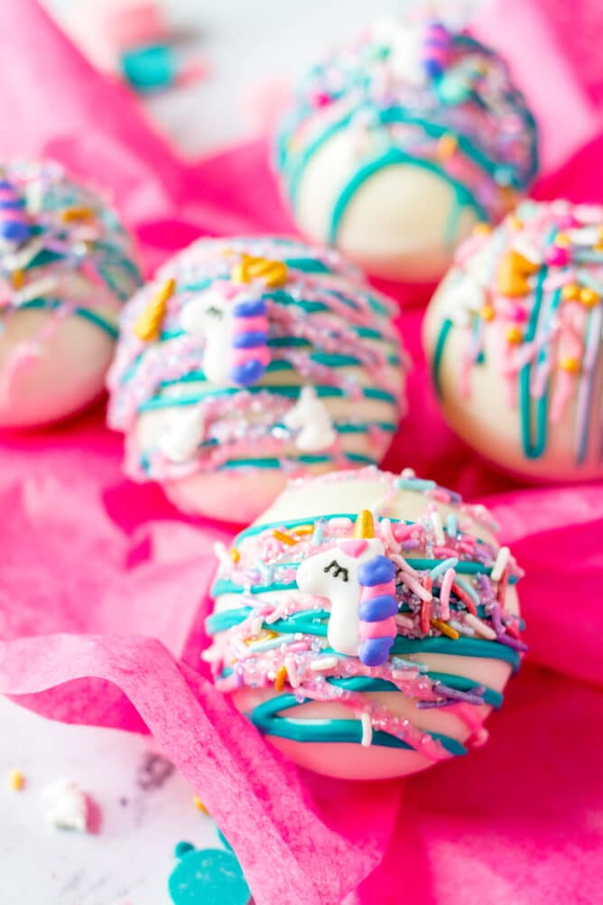 White hot chocolate bombs decorated as unicorns