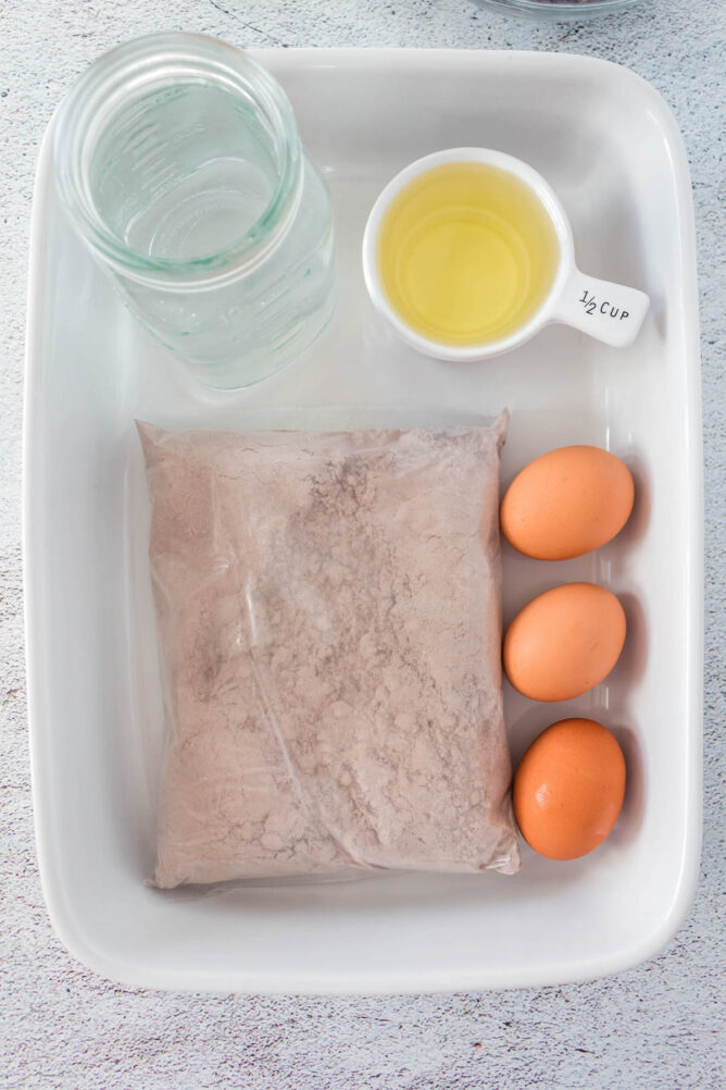 Overhead shot of ingredients to make a chocolate cake from cake mix