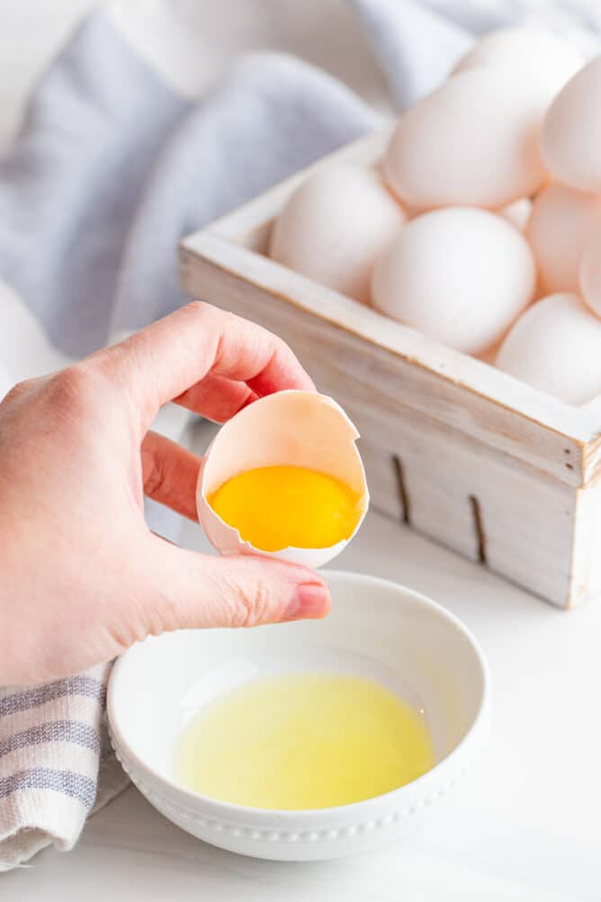 One egg being separated into a small bowl