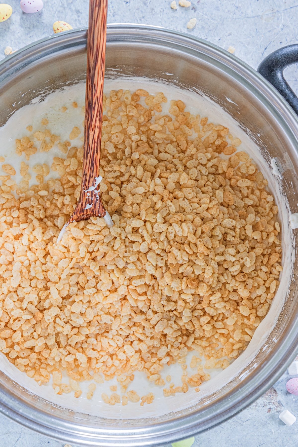 process shot of easter Rice Krispie treats being made.