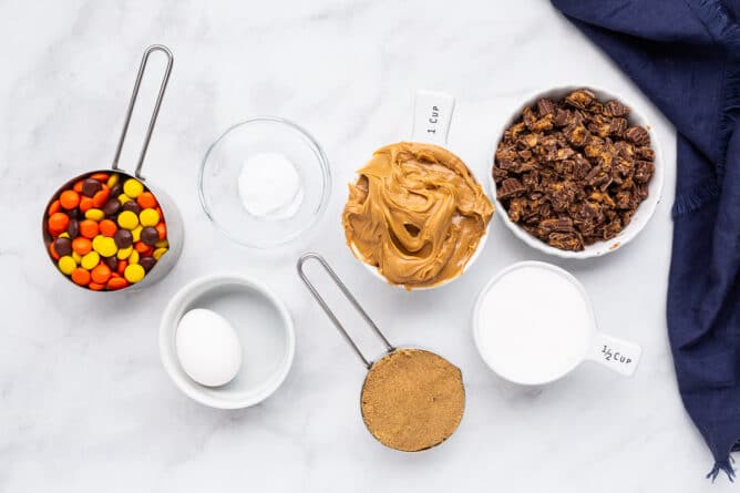 Overhead shot of all the ingredients measured out to make Reese's overload peanut butter cookies