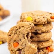 Stack of Reese's overload peanut butter cookies with one cookie missing a bite from it