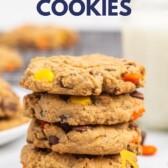 Stack of Reese's overload peanut butter cookies with recipe title on top of image