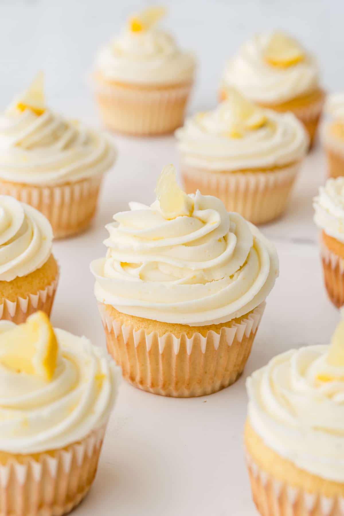 A bunch of perfect triple lemon cupcakes topped with lemon buttercream