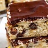 Close up shot of banana bars stacked on one another with recipe title on top of image