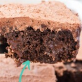 Side view of chocolate poke cake showing ganache filling inside and recipe title on top of image