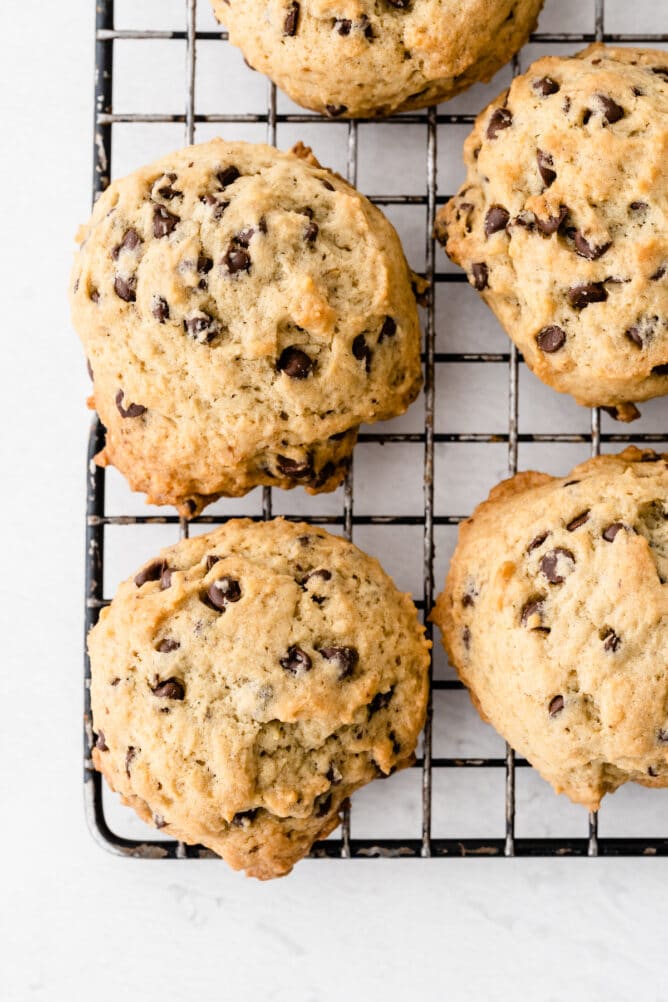Overhead shot of banana chocolate chip cookies in a wire cooling rack