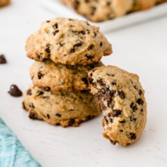 Stack of banana chocolate chip cookies with one tilted on side of stack