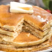 Stack of easy fluffy pancakes with one bite missing