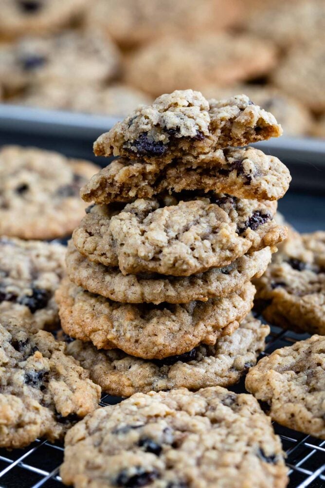 Lots of oatmeal raisin cookies on a wire cooling rack