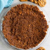 Overhead shot of chocolate chip cookie crust with chocolate chip cookies around it